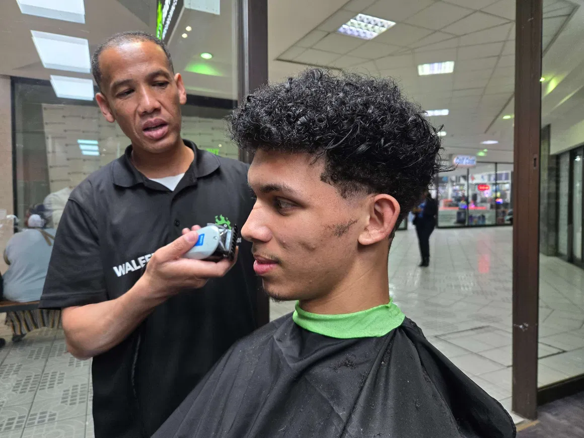 Waleed lining up a client's fade