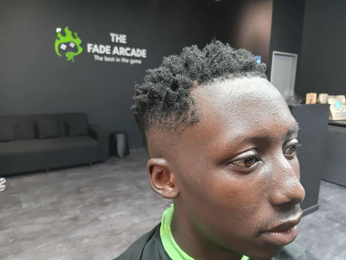 Sharp fade and curls after a cut