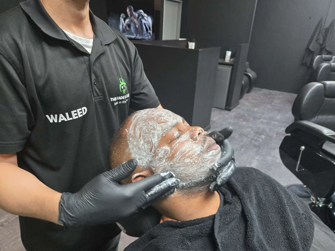 Busy shop floor with barbers at work